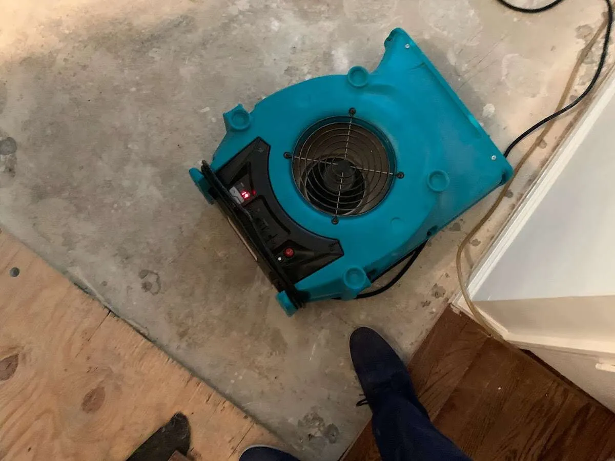 Air mover drying subfloor during Leak Detection & Repair in Trussville